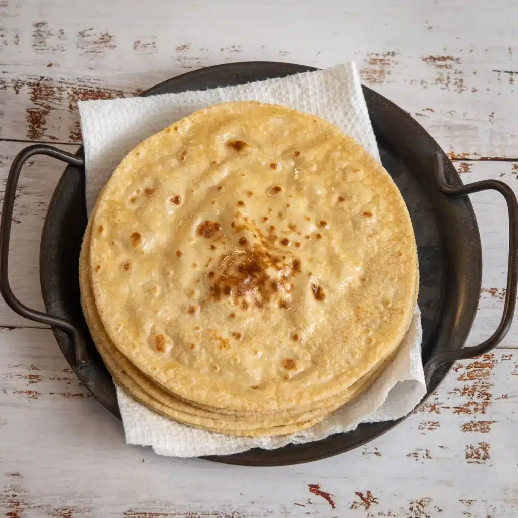 a stack of Indian roti on a plate