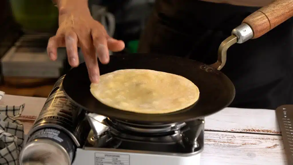 Soft Indian Roti (Chapati) Recipe – Easy & Authentic cooking roti on iron tawa