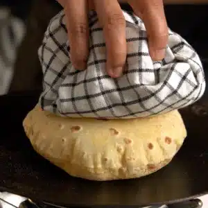 Whole wheat Indian flatbread (roti) puffed and golden