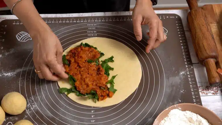 place spinach and potato mix on one side of turkish gozleme