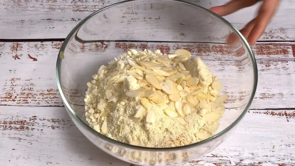 Mango Sesame Cake : No Flour, No Egg, just 5 Ingredients mix roasted sesame with mango puree, chopped almond and almond flour