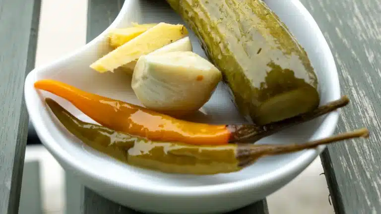 Quick pickled cucumber with chili, ginger and garlic on a plate