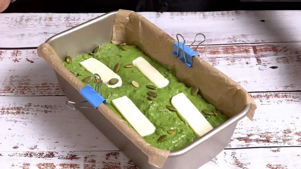 Green Bread - Full of Greens, Cheese and Nuts add more mixture and cheese and seeds