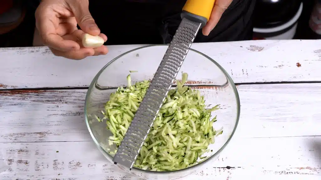 Easy No Dough Zucchini Paratha grate garlic with zucchini