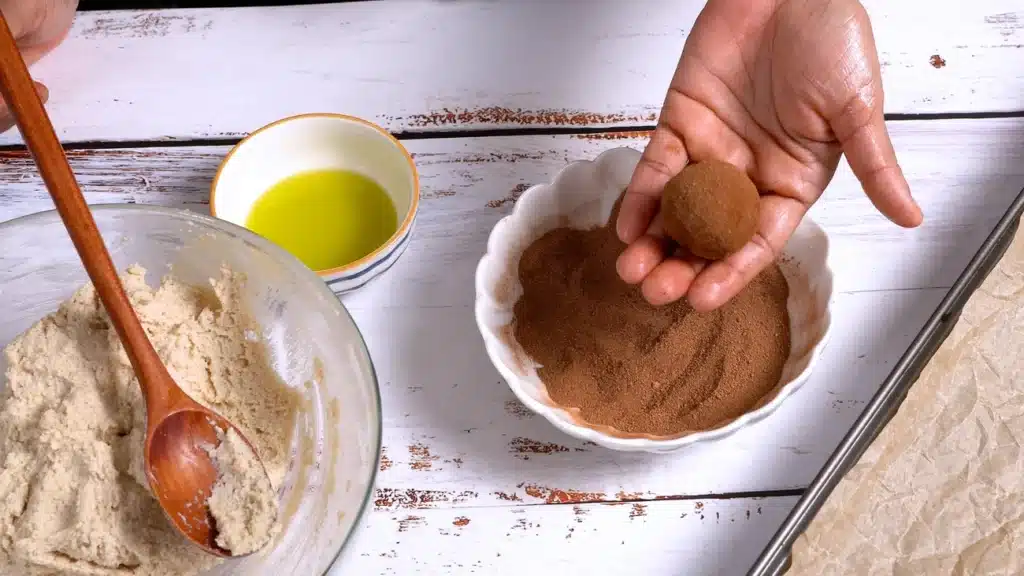 Protein Rich Baked Gluten Free Donut Balls make balls from dough and coat them with cinnamon sugar mixture