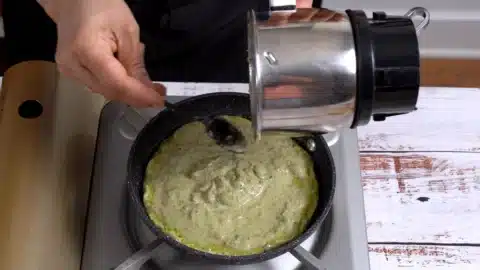 pour blended lentil in a pan