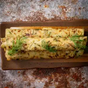 zucchini paratha rolled on a tray
