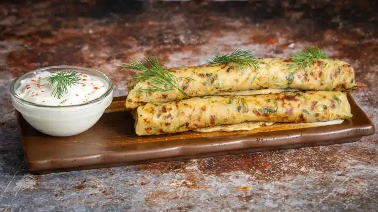 zucchini paratha with yogurt zucchini paratha rolled on a tray