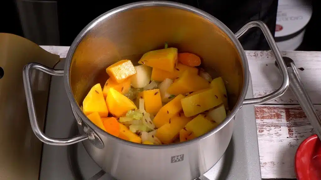 A Bowl of Butternut Squash Soup to Brighten Chilly Evenings cook celery, potato, onion and squash for 2 minutes