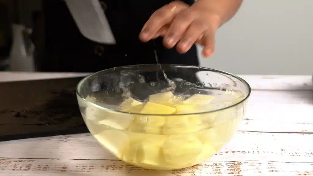 Buttery Irish Potato Cakes – Crispy Outside, Soft Inside cut potatoes and drop them in water