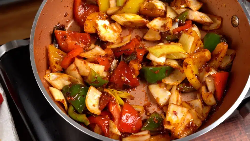 Devilled Chicken - Perfect Appetizer For Spice Lovers mix leek, onion and pepper together