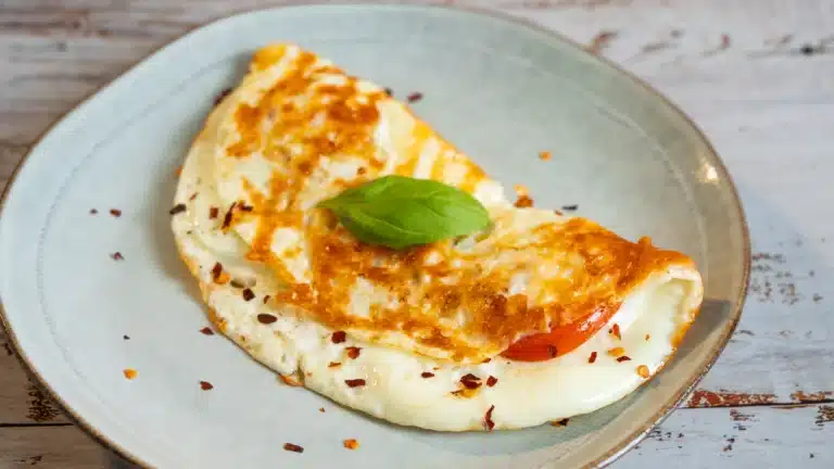 22 Best Omelette Recipes: Stop Eating Sad Eggs Today mozzarella omelette on a plate