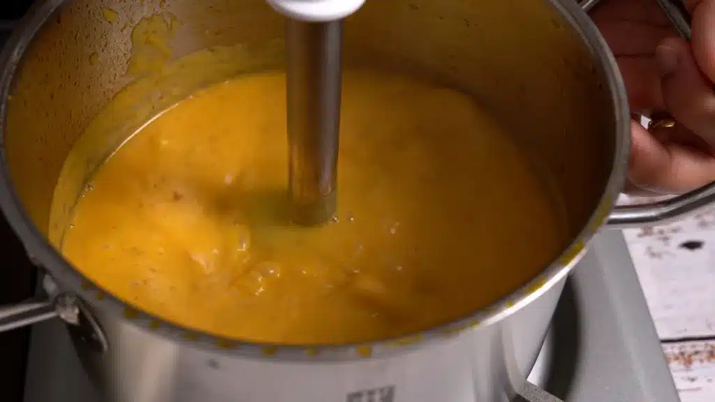 A Bowl of Butternut Squash Soup to Brighten Chilly Evenings once cooked, blend it with hand blender