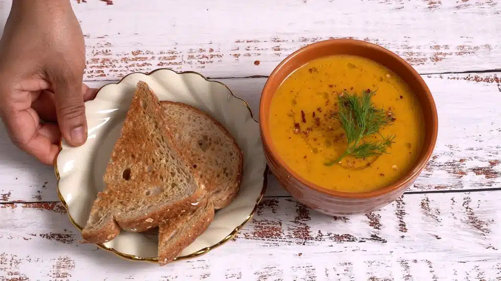 A Bowl of Butternut Squash Soup to Brighten Chilly Evenings serve hot with toasted bread