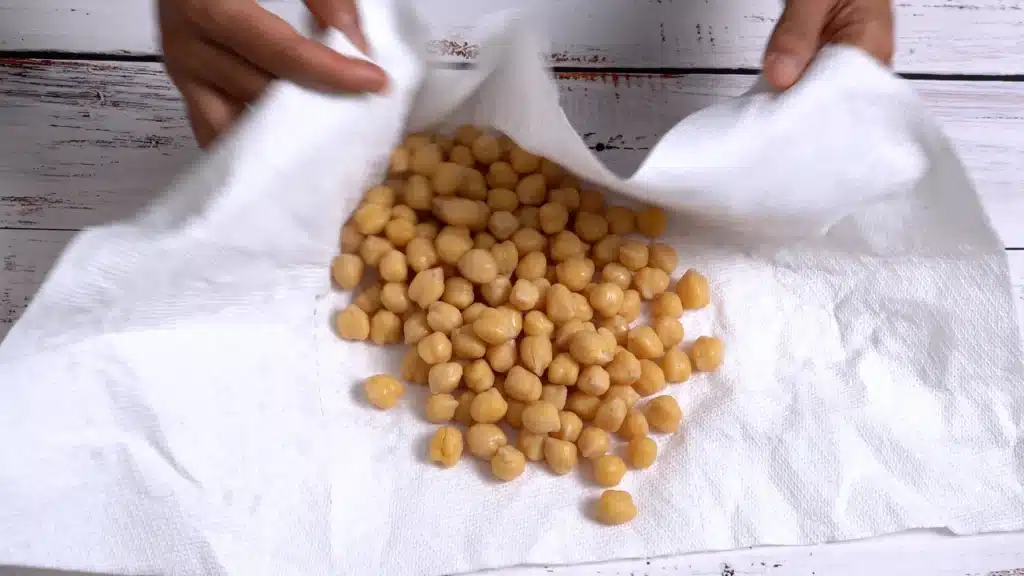 Crunchy Cinnamon Chickpeas - A Perfect Snacks wipe dry washed chickpea with hand towel
