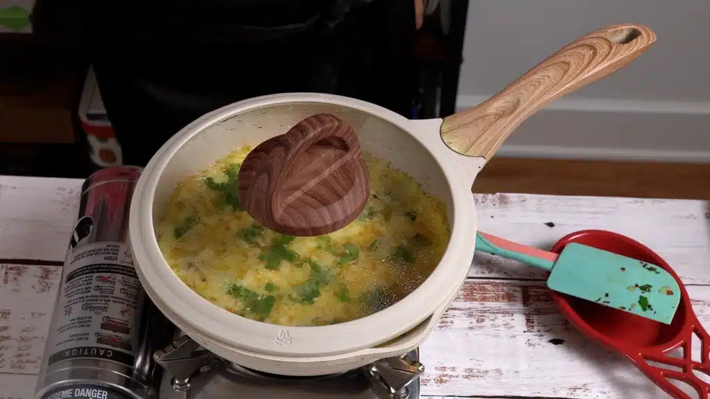 cover the pan and let it cook until bottom is set