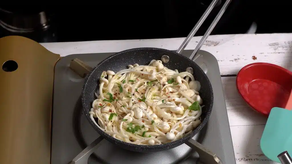 on a pan add mushrooms with salt, pepper and chili flakes
