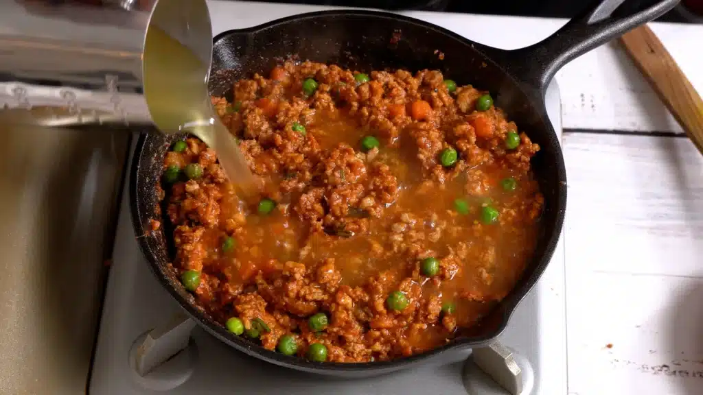 add chicken broth and cook until water evaporated