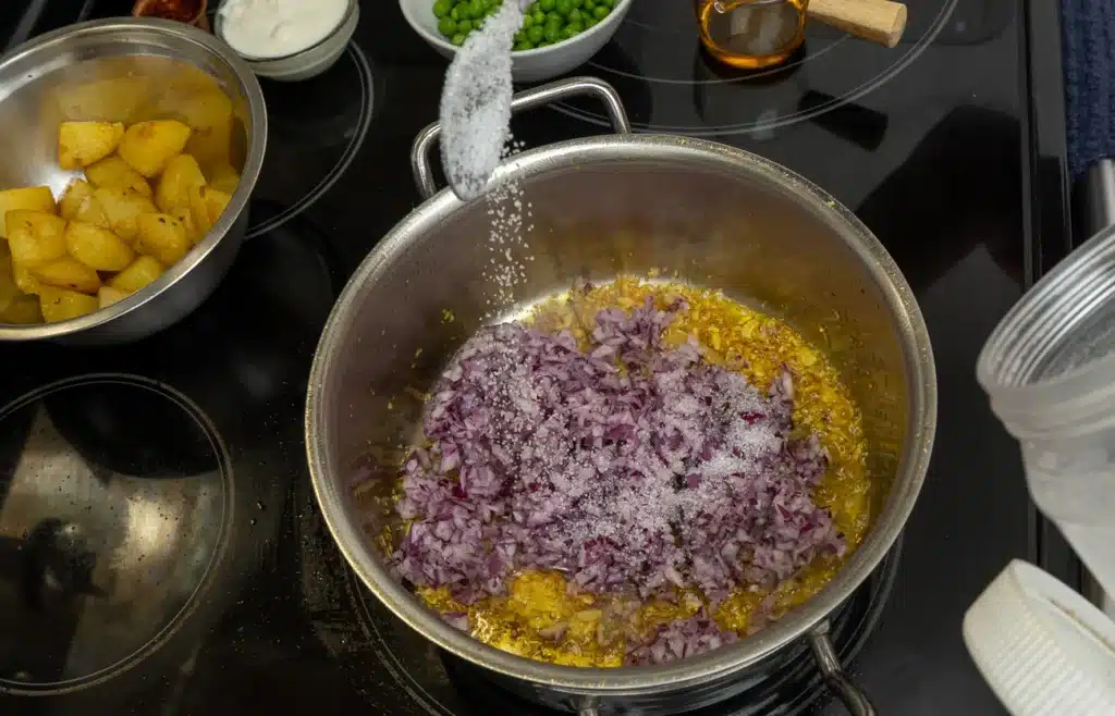 add chopped onion with pinch of sugar