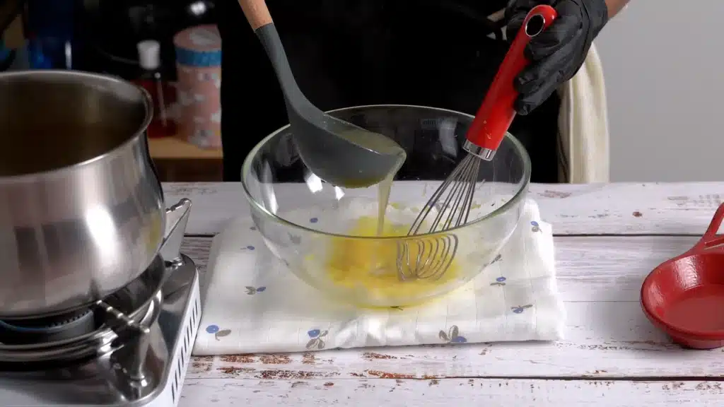 add hot stock in whisked egg and mix