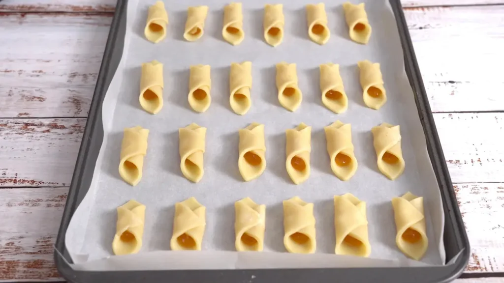 cream cheese cookies ready to bake on a baking tray