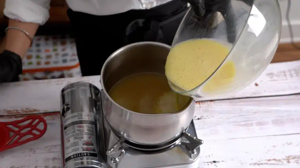 pour back mixed egg yolk mix in stock