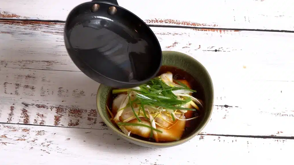 Simple Steamed Fish Ready in 20 minutes pour hot oil on fish