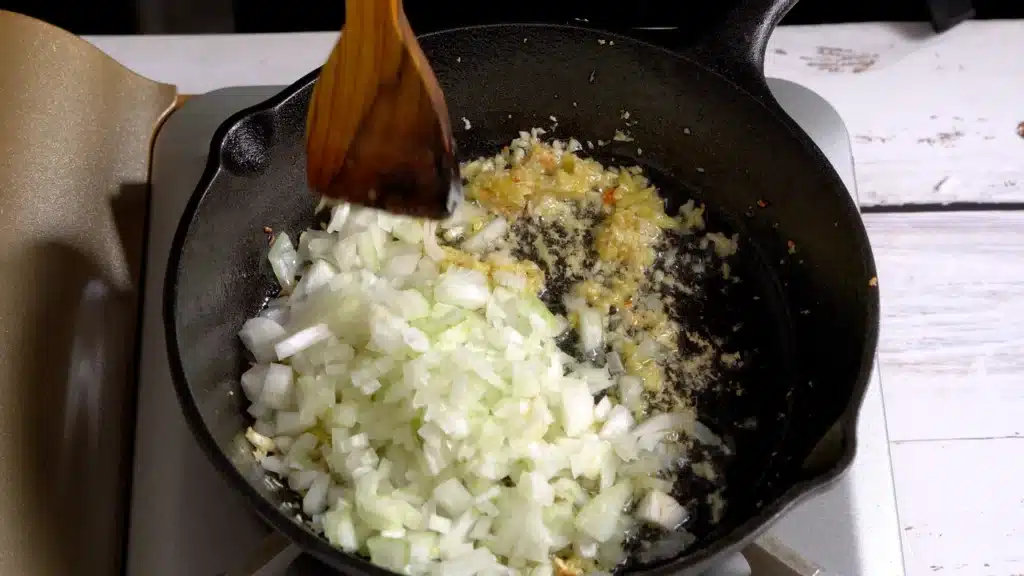 sauté ginger garlic until golden and add onion