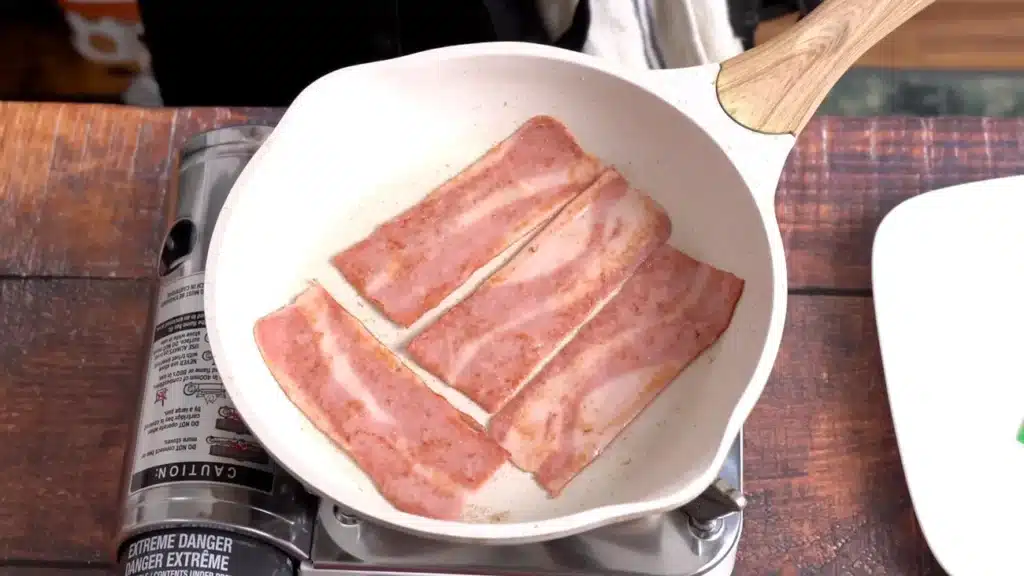 spray oil on a pan and cook chicken strips.