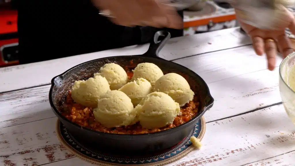 spread sweet potato mix layer over chicken mix