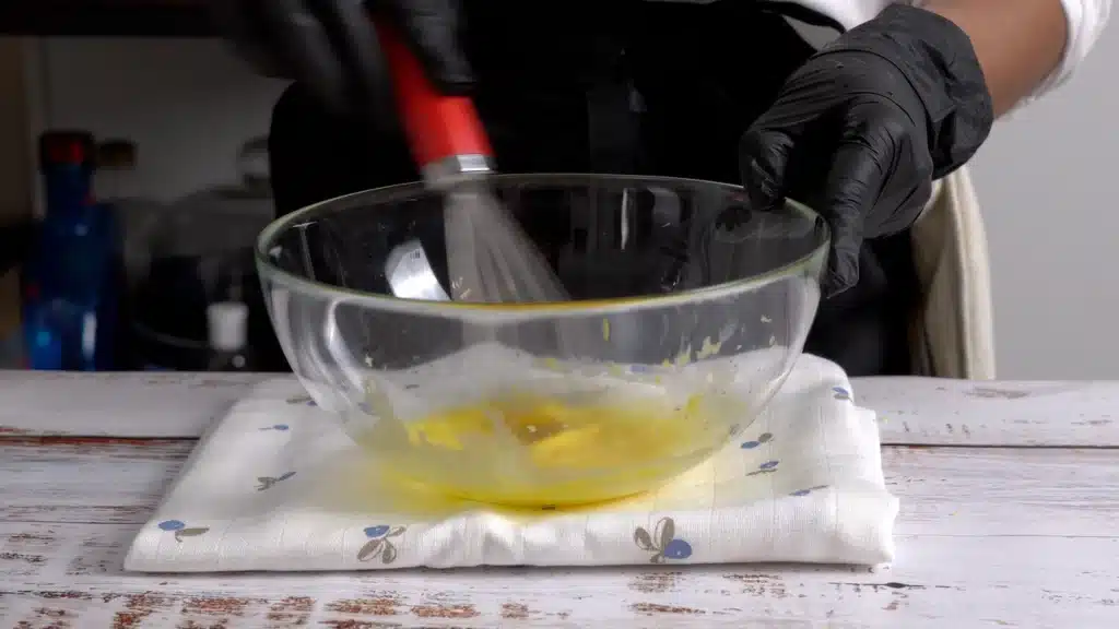 whisk egg yolk, lemon zest, lemon juice in a bowl until creamy