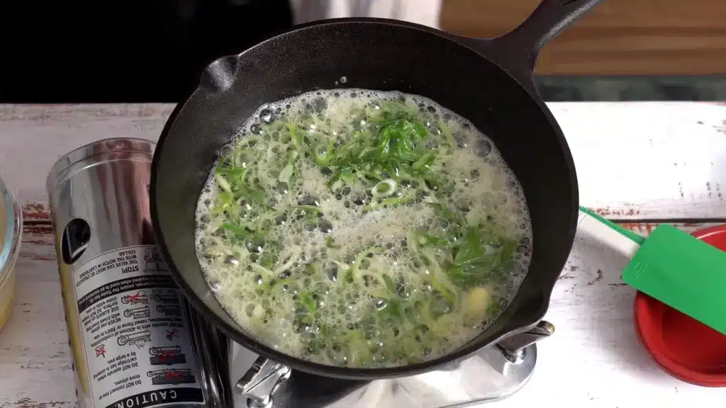 heat butter in pan & add green onion