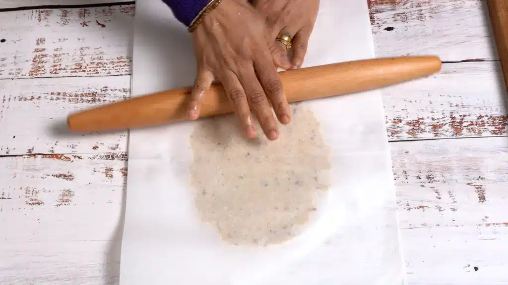 place dough between 2 parchment paper and roll thin