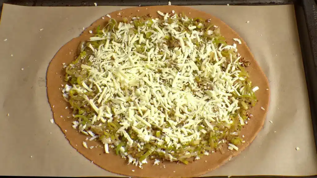 Healthy Leek Rustic Pie For Your Gut & Blood Sugar spread cheese, vegetables, herbs and olive oil