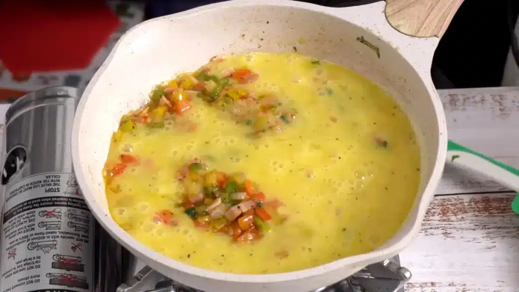 add egg mixture in pan and spread evenly