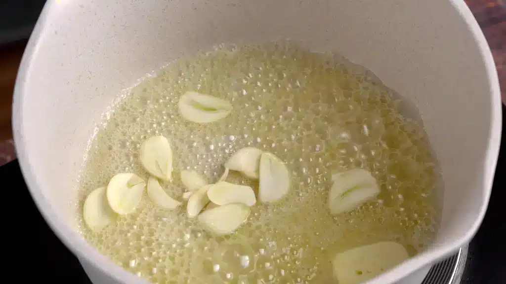 add sliced garlic and let it cook for a min