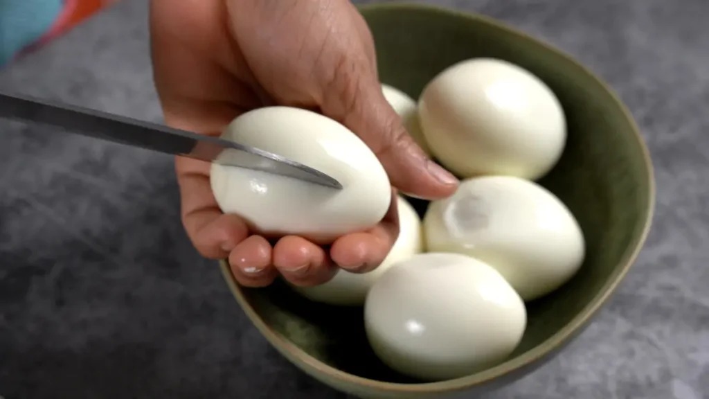 Egg Curry in 45 Mins: Quick & Spicy Comfort Food make small cuts on eggs