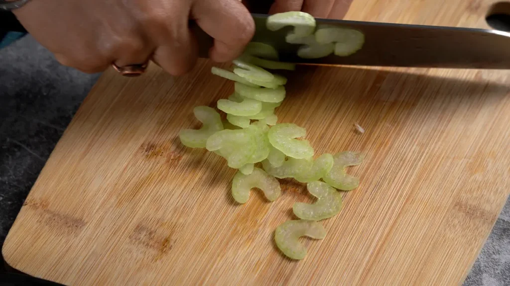 Egg Curry in 45 Mins: Quick & Spicy Comfort Food start by chopping celery, onion and tomato
