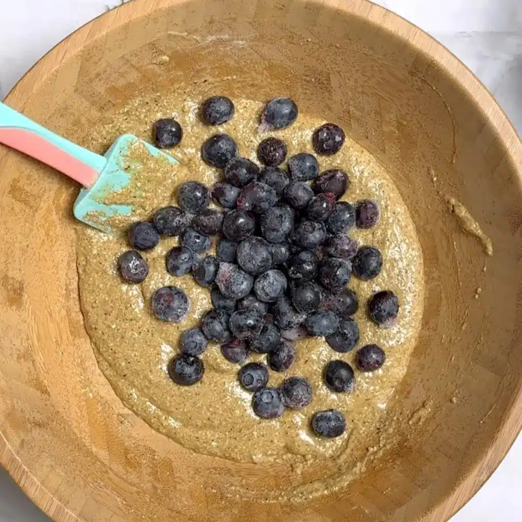 Batter with fresh blueberries on top