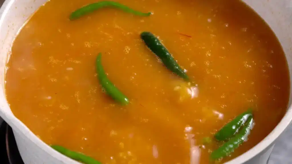 add fish broth with green chili