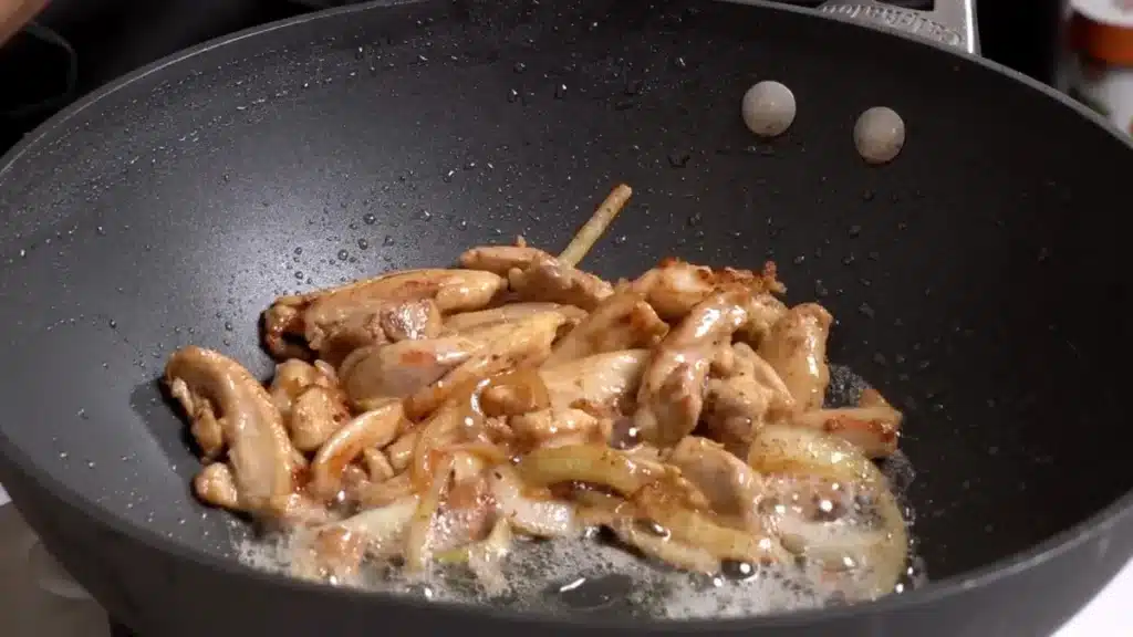 Chicken Thai Glass Noodles: Delicious & Quick 30-Min Recipe in a wok cook chicken and onion
