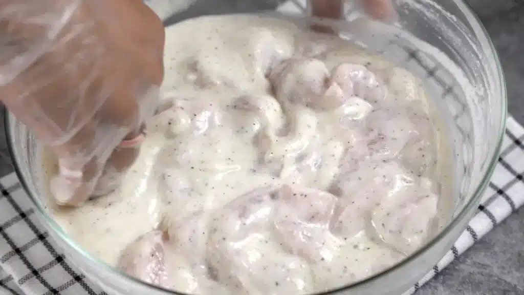 marinate chicken with onion paste, yogurt, salt and pepper