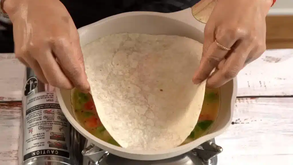 Cheesy Tortilla Omelette: Quick 15-Minute Recipe place another tortilla to cover egg mix