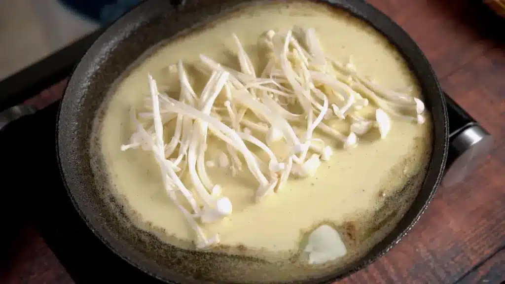 Korean Enoki and Chicken Pajeon: Delicious Meal in 25 mins pour batter and add mushroom