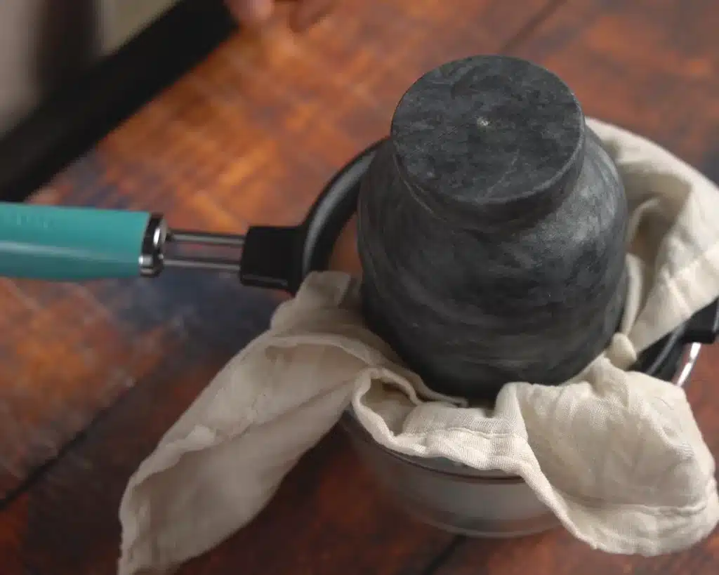 Apply a gentle weight to the cloth and refrigerate it to drain the water completely