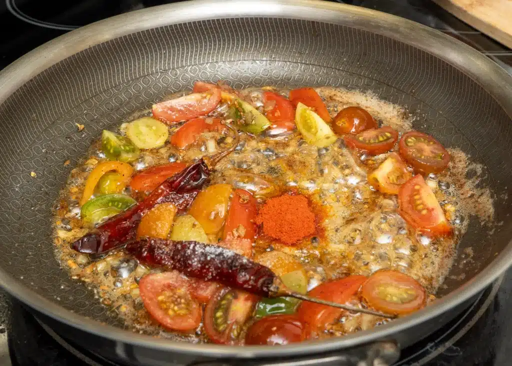 add tomato & red chili powder for taste