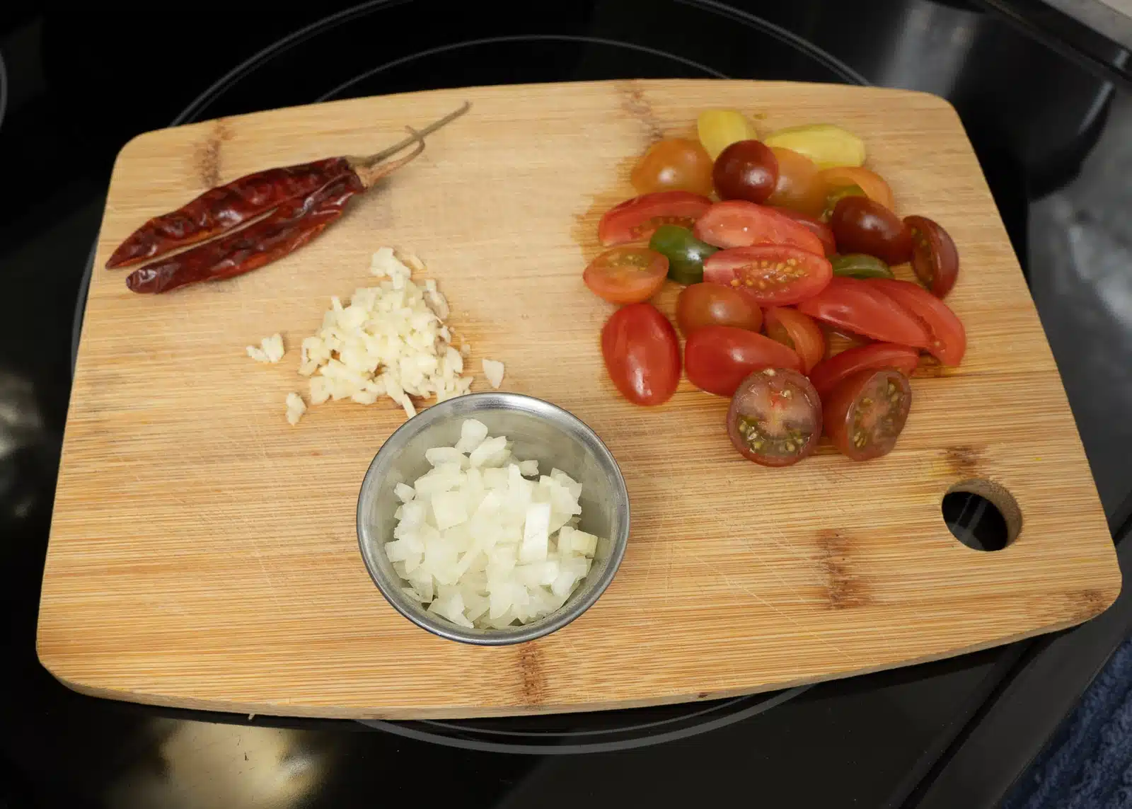 for tempering - dry red chili, garlic, onion & cherry tomato(cumin seeds also)