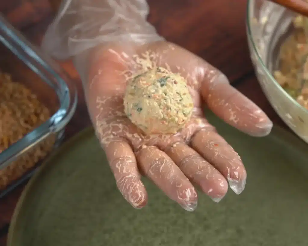 Shape this thick, creamy base into small, even croquettes using your hands.