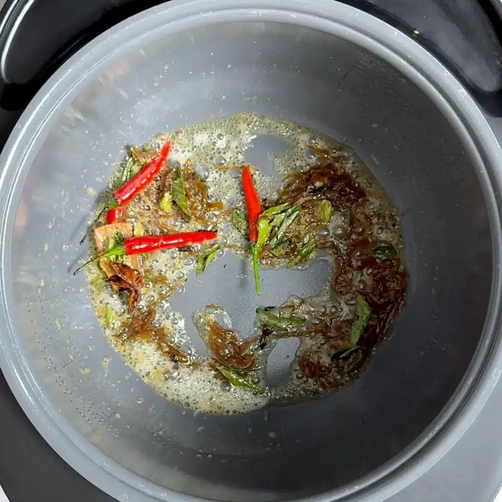Slow Cooked Coconut Chicken Stew: Easy & Delicious Recipe add curry leaves, chilli, ginger garlic, caramelized onion