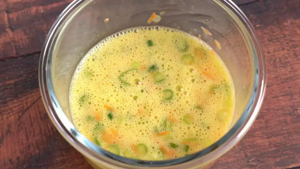 Tamagoyaki - Rolled Omelette In Easy Steps (With Video) mix eggs, carrot, green onion with salt & pepper